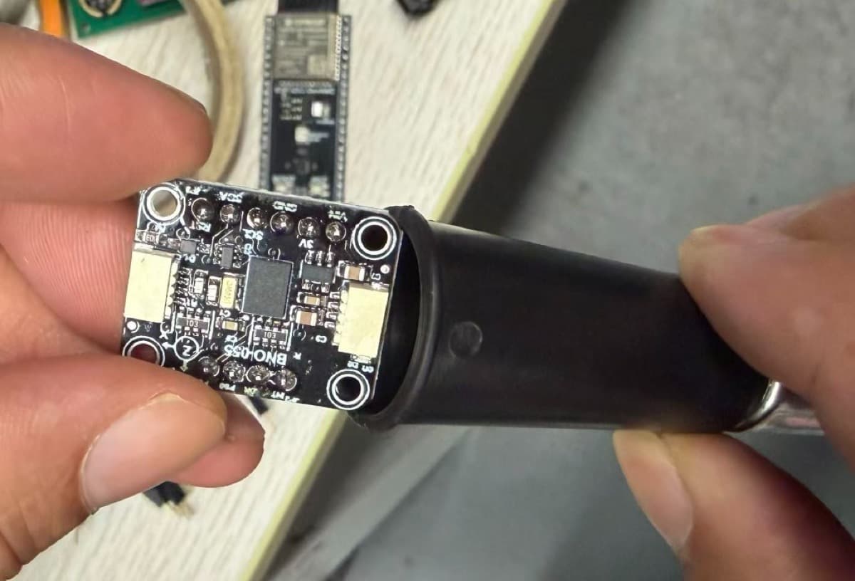 BNO055 IMU sensor assembly inside an interactive training fire extinguisher prototype